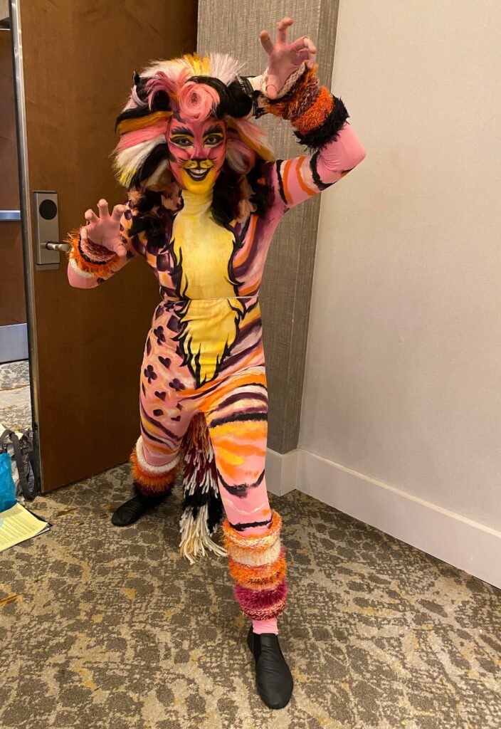 A humanoid re-interpretation of Disney's portrayal of the Cheshire Cat.